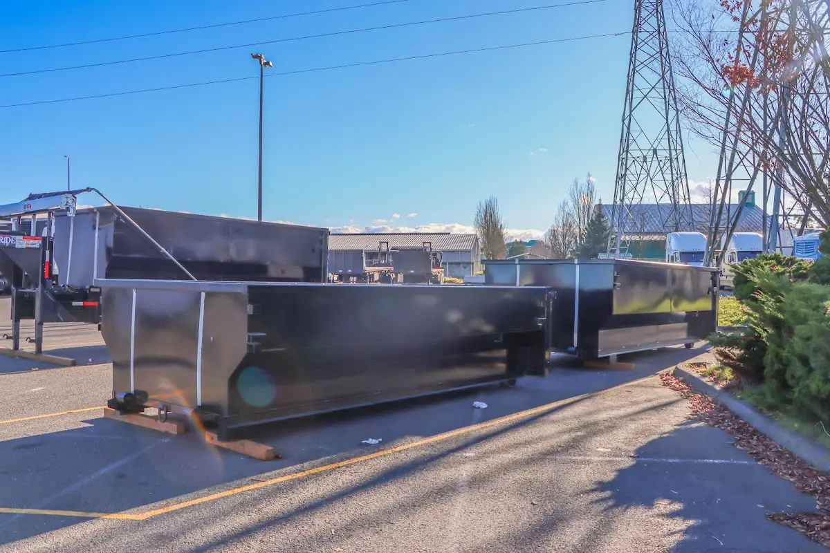 Roll-off dumpster ready for waste disposal at job site for Demolition Dumpster Rental in Ionia
